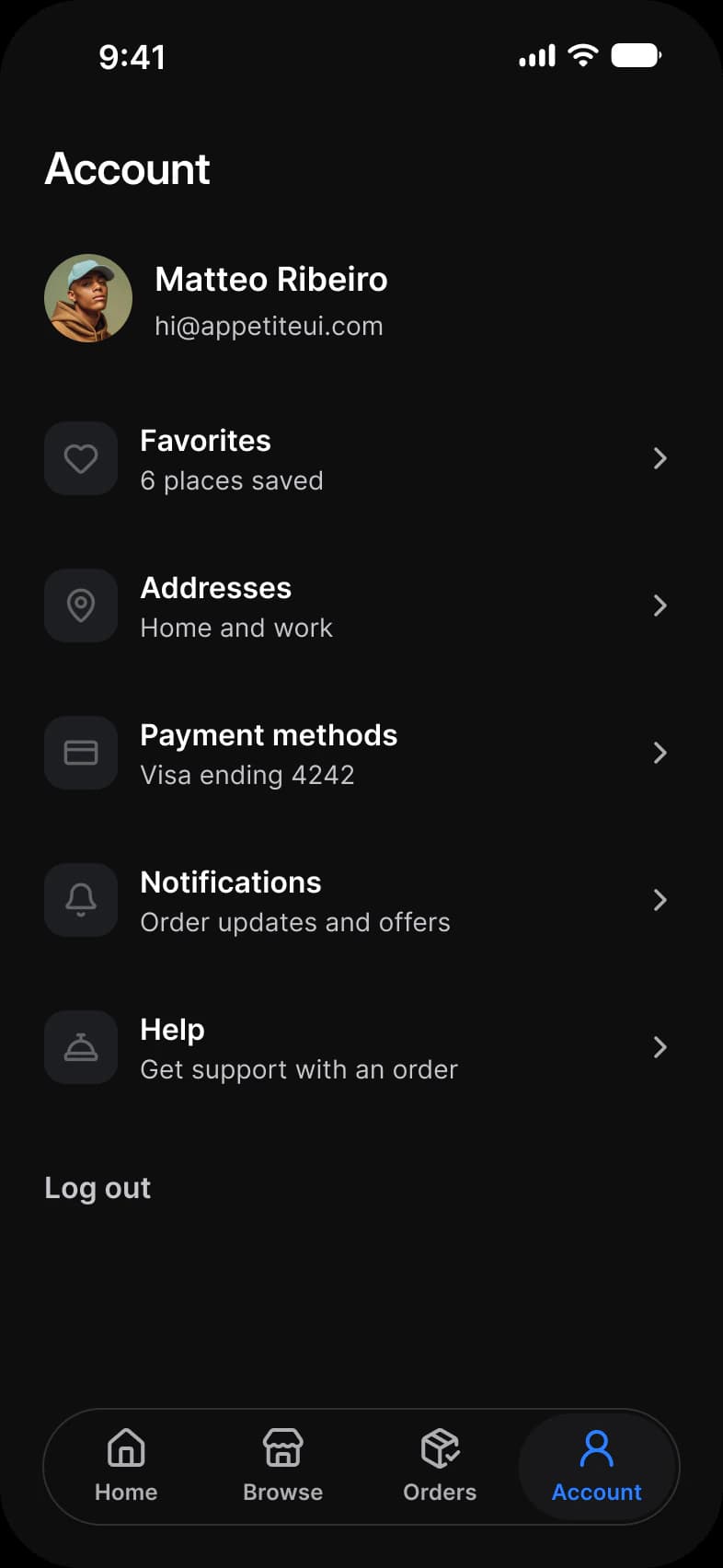 Foodie app Account screen in dark mode: Matteo Ribeiro with his photo, rows for Favorites, Addresses, Payment methods, Notifications and Help, and a Log out button above a floating tab bar