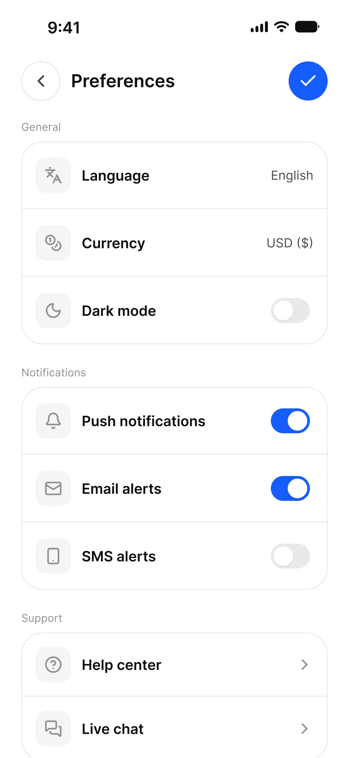 Preferences screen in light mode: language, currency and dark mode rows, and switches for push, email and SMS alerts